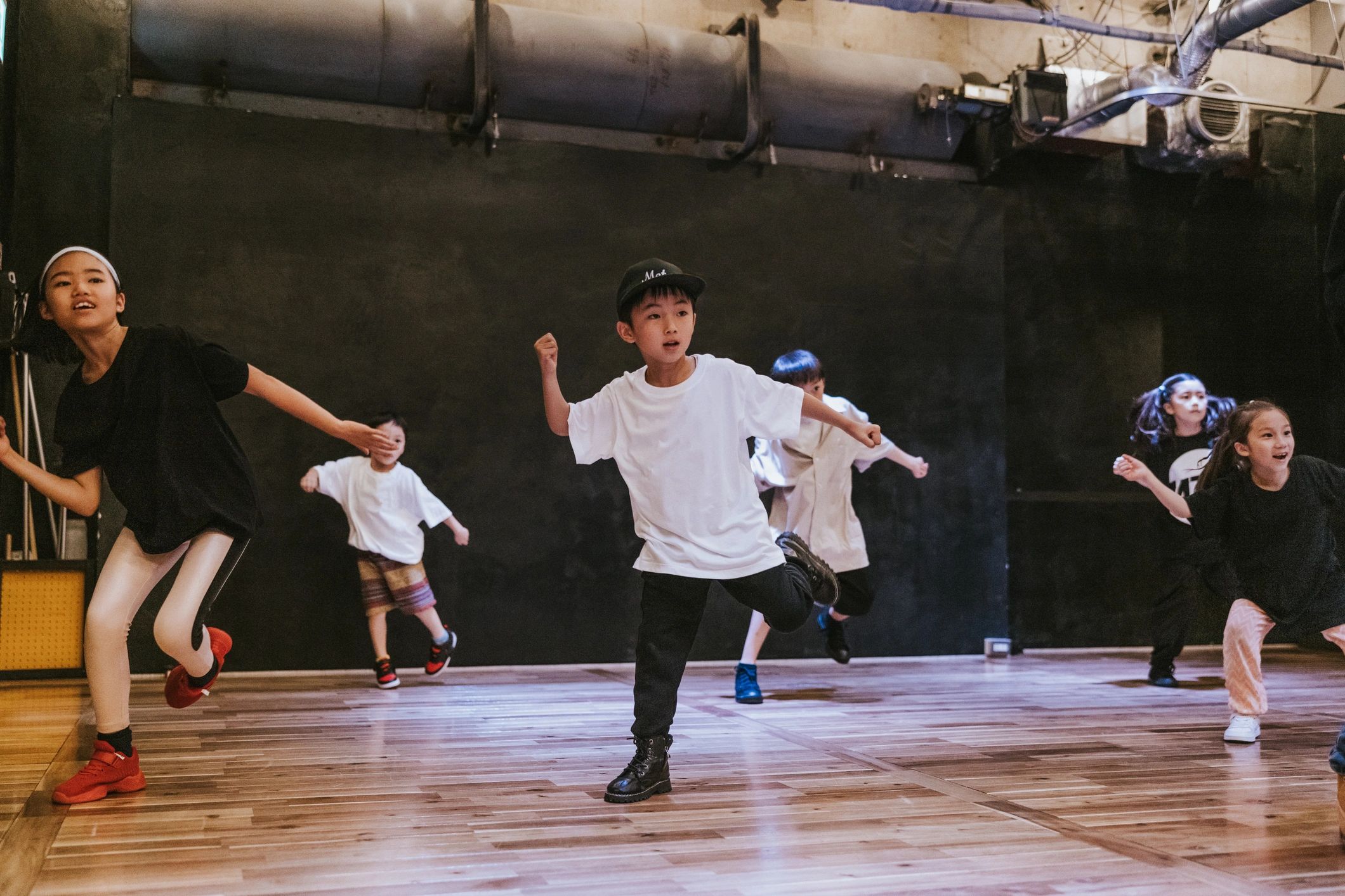 Japanese kids immersed in the rhythm and flow of a hip-hop breakdance class